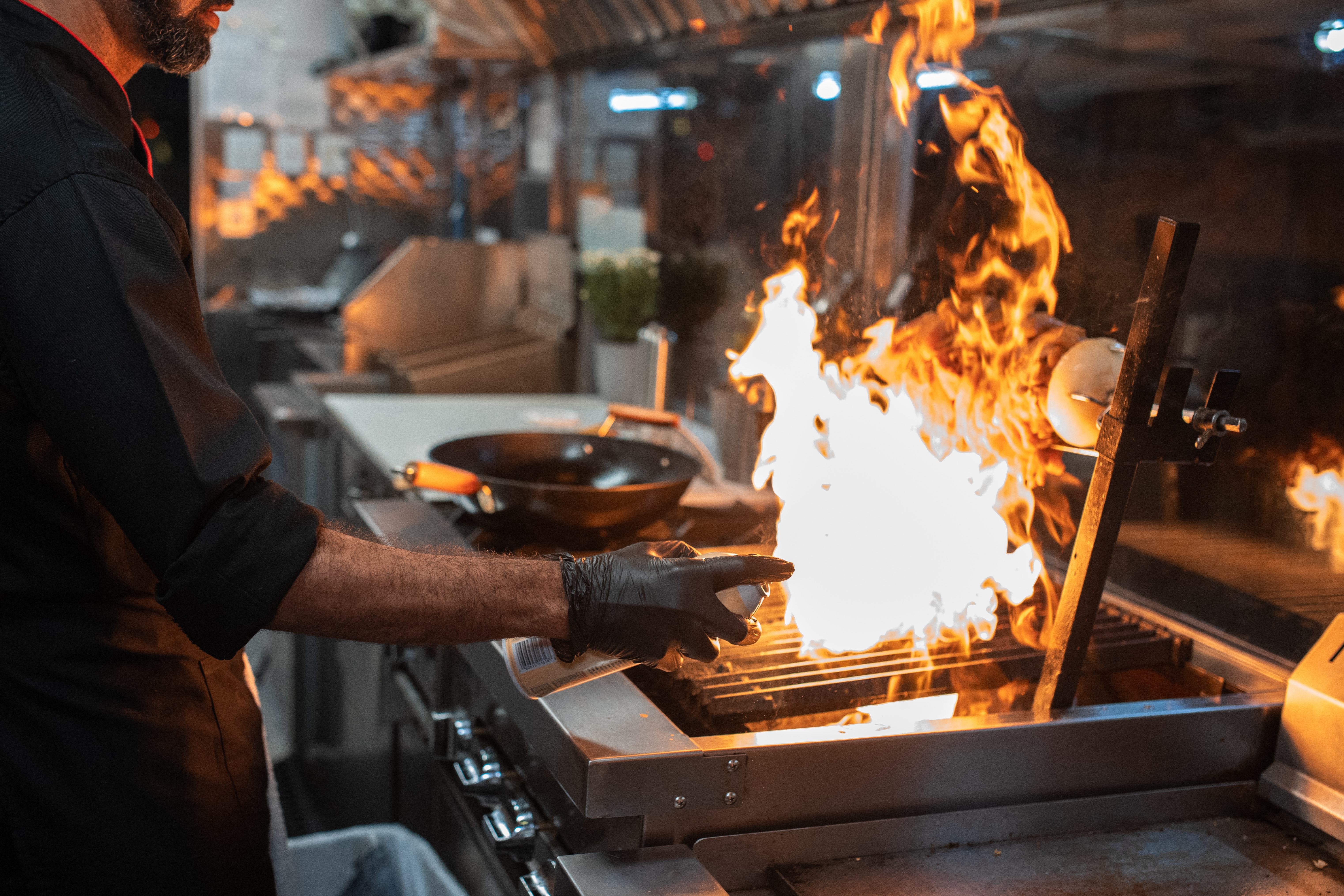 Chef cooking inside the Game Day Grill